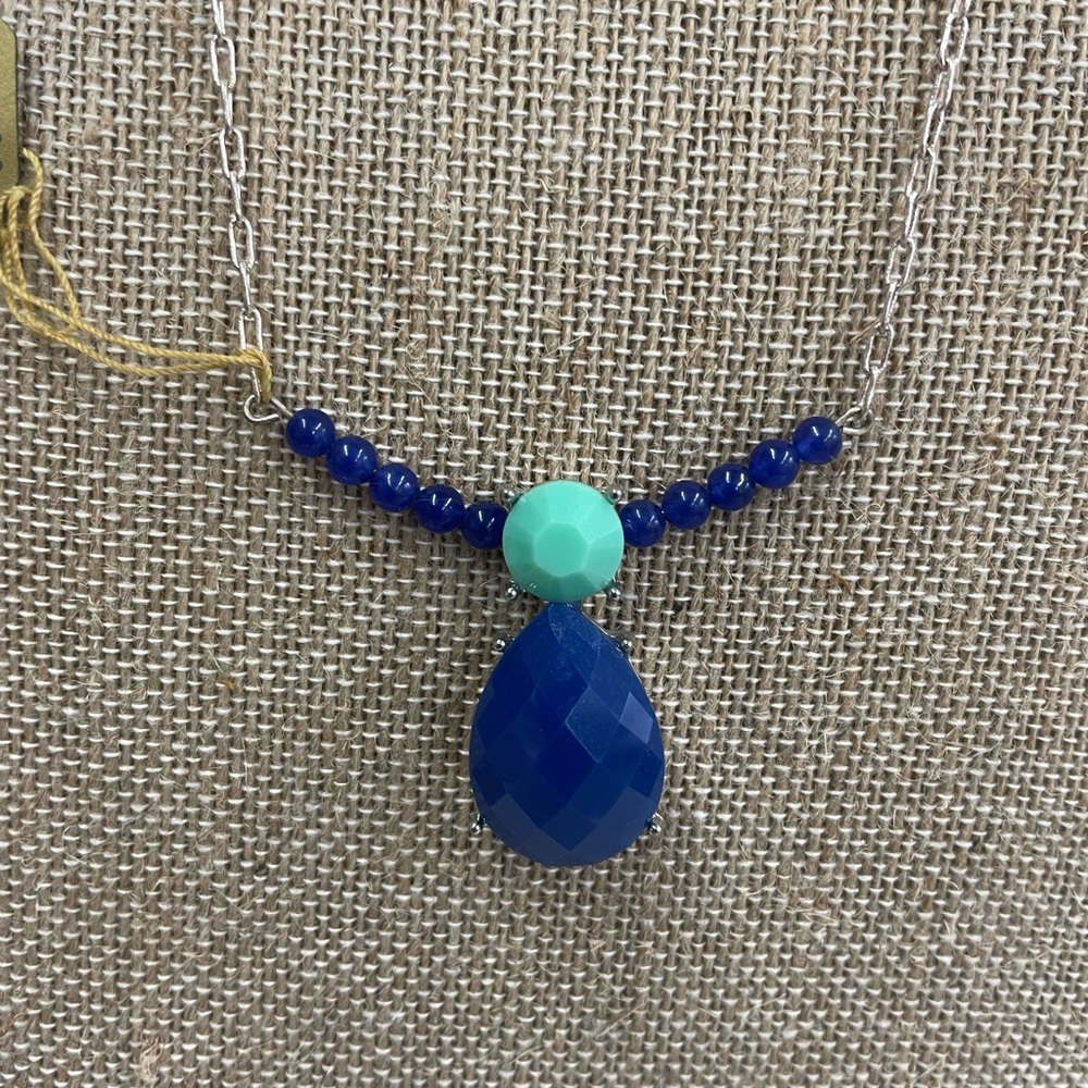 Turquoise and blue with silver tone chain.
